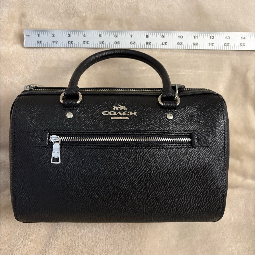 Coach Rowan Satchel. Comes with its long cross body strap and care cards. NWOT